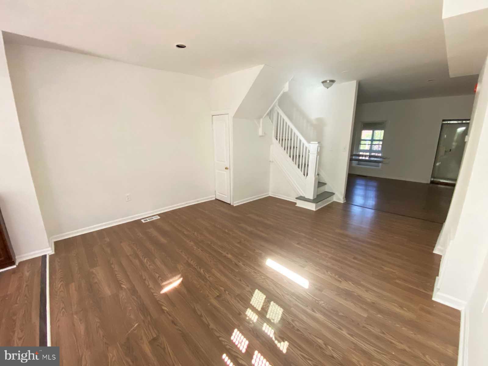 3015 Rayner Avenue Baltimore, MD 21216 - Photo 31 of 71 a view of empty room with wooden floor