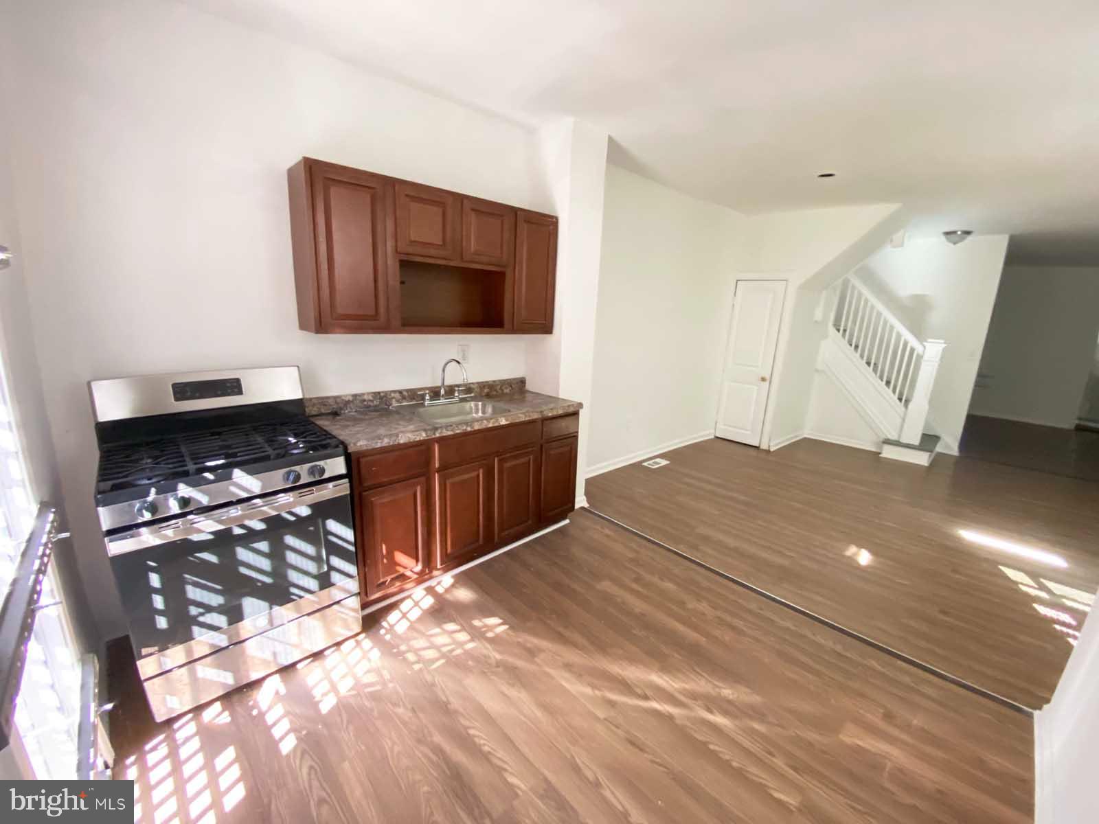 3015 Rayner Avenue Baltimore, MD 21216 - Photo 33 of 71 a bedroom with a bed and a flat screen tv