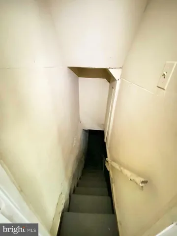 a view of a backyard with a wooden fence