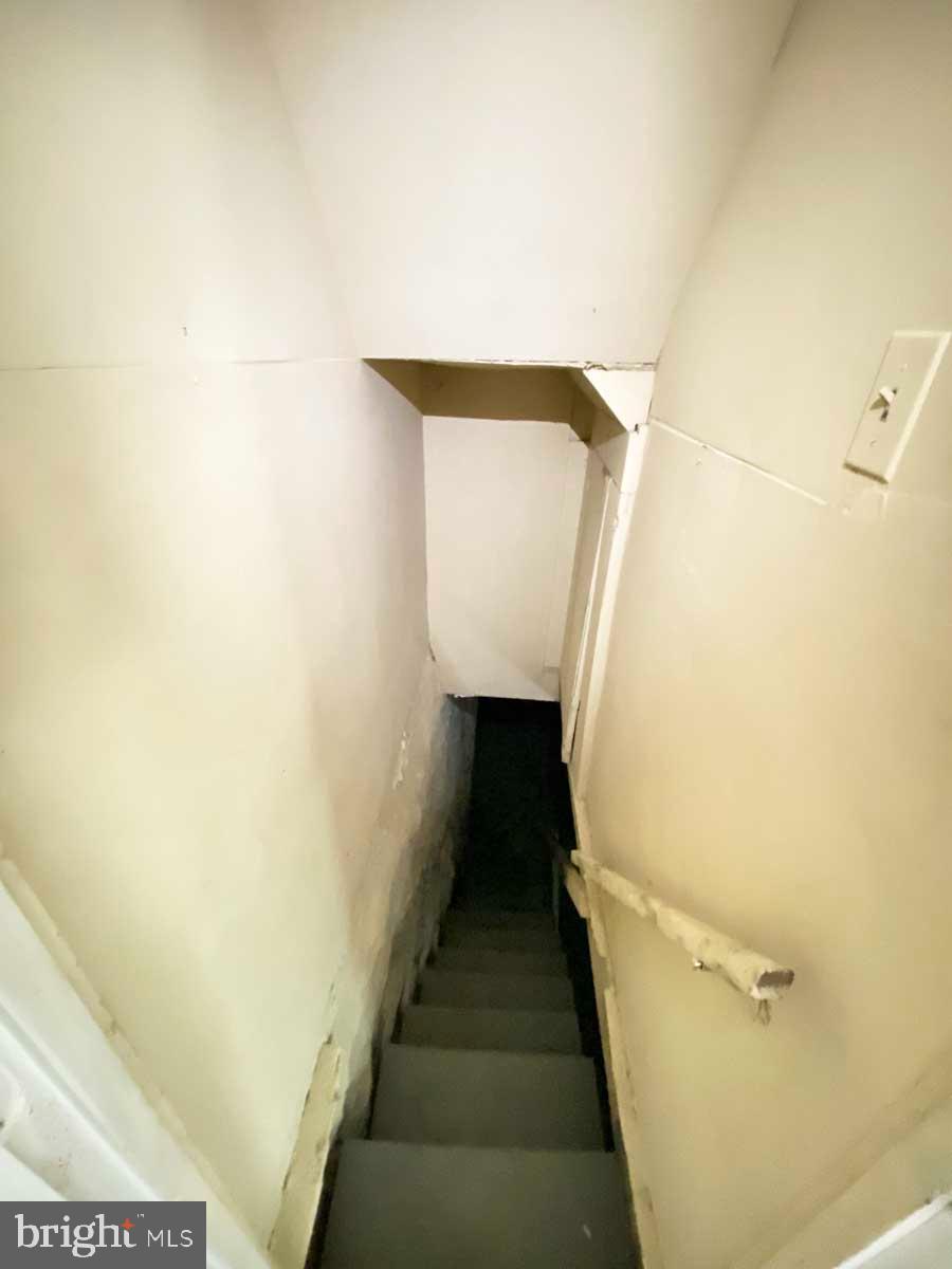 3015 Rayner Avenue Baltimore, MD 21216 - Photo 37 of 71 a view of stairs and utility room