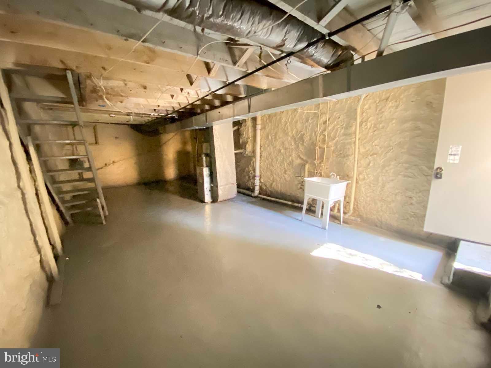 3015 Rayner Avenue Baltimore, MD 21216 - Photo 44 of 71 a view of an empty room with a couch