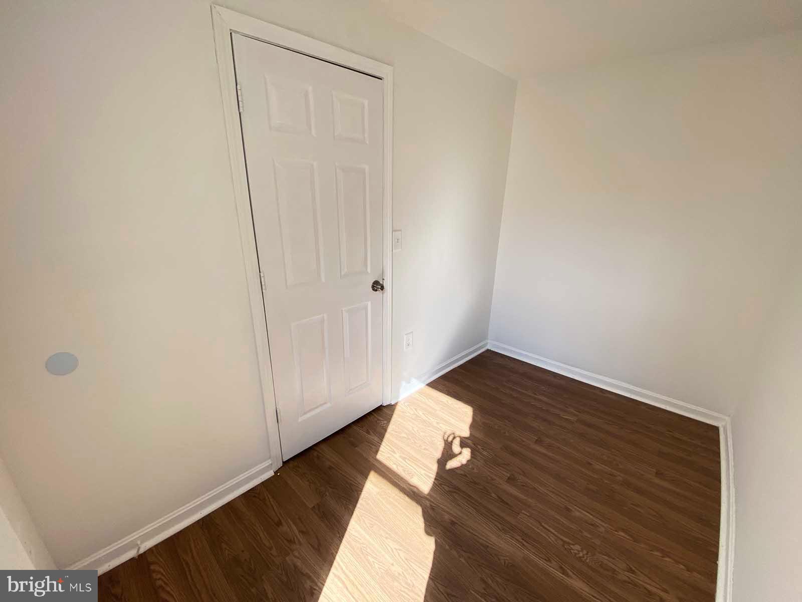 3015 Rayner Avenue Baltimore, MD 21216 - Photo 10 of 71 a view of empty room with wooden floor