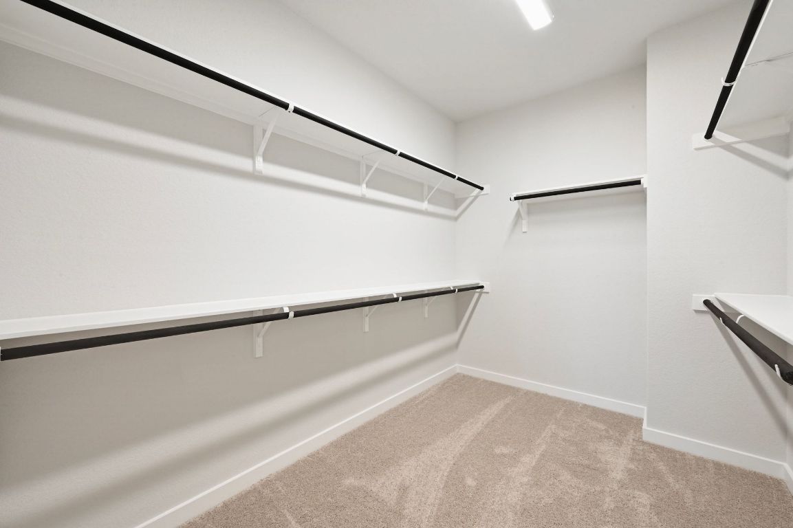 144 Granit Oak Drive Dripping Springs, TX 78620 - Photo 15 of 33 a view of a room with racks on the wall