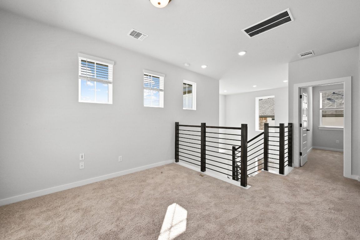 144 Granit Oak Drive Dripping Springs, TX 78620 - Photo 20 of 33 a view of a livingroom with furniture and staircase