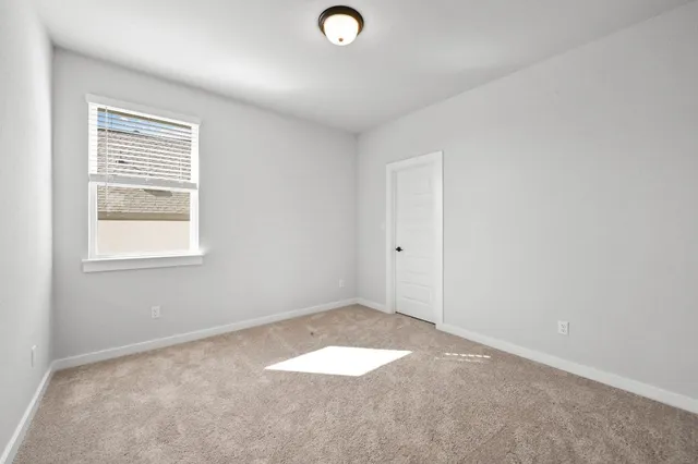a bathroom with a toilet a sink a tub and mirror