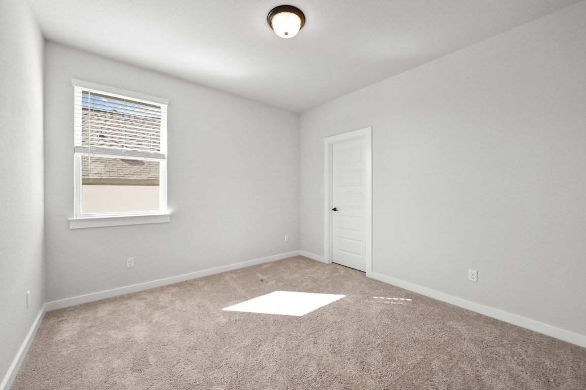 144 Granit Oak Drive Dripping Springs, TX 78620 - Photo 21 of 33 an empty room with a window