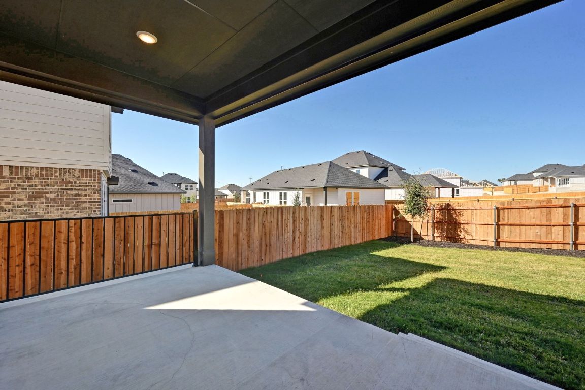 144 Granit Oak Drive Dripping Springs, TX 78620 - Photo 23 of 33 a view of a backyard with a garden