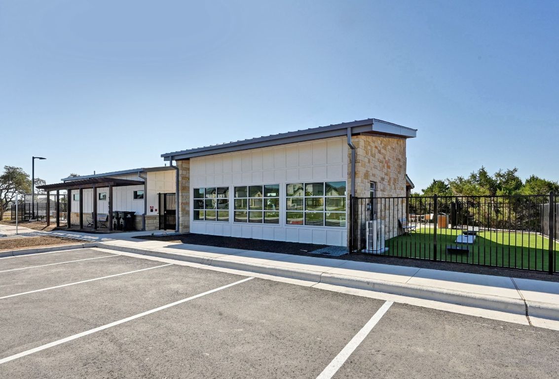 144 Granit Oak Drive Dripping Springs, TX 78620 - Photo 29 of 33 a view of a street with a building in front of it