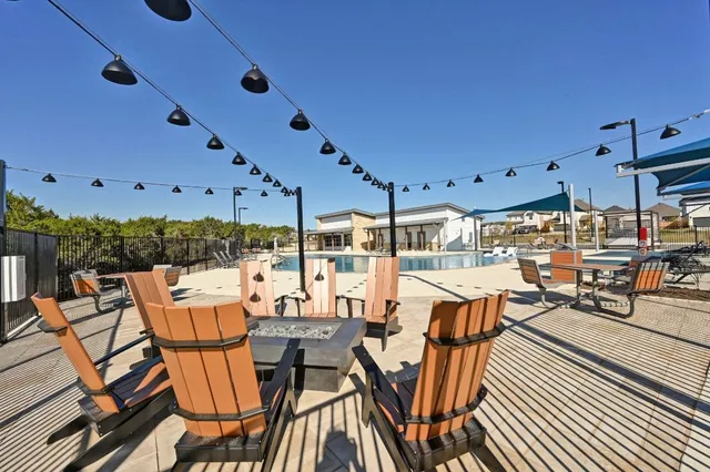 a balcony with furniture and city view