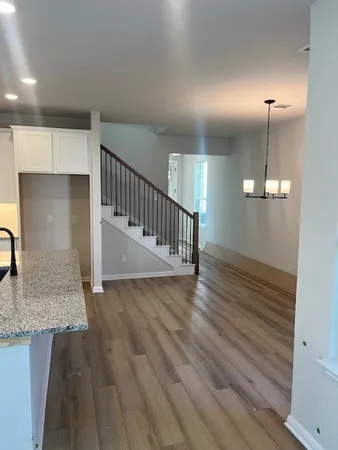 an empty room with wooden floor