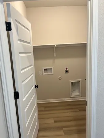 a toilet sitting in a bathroom next to a window