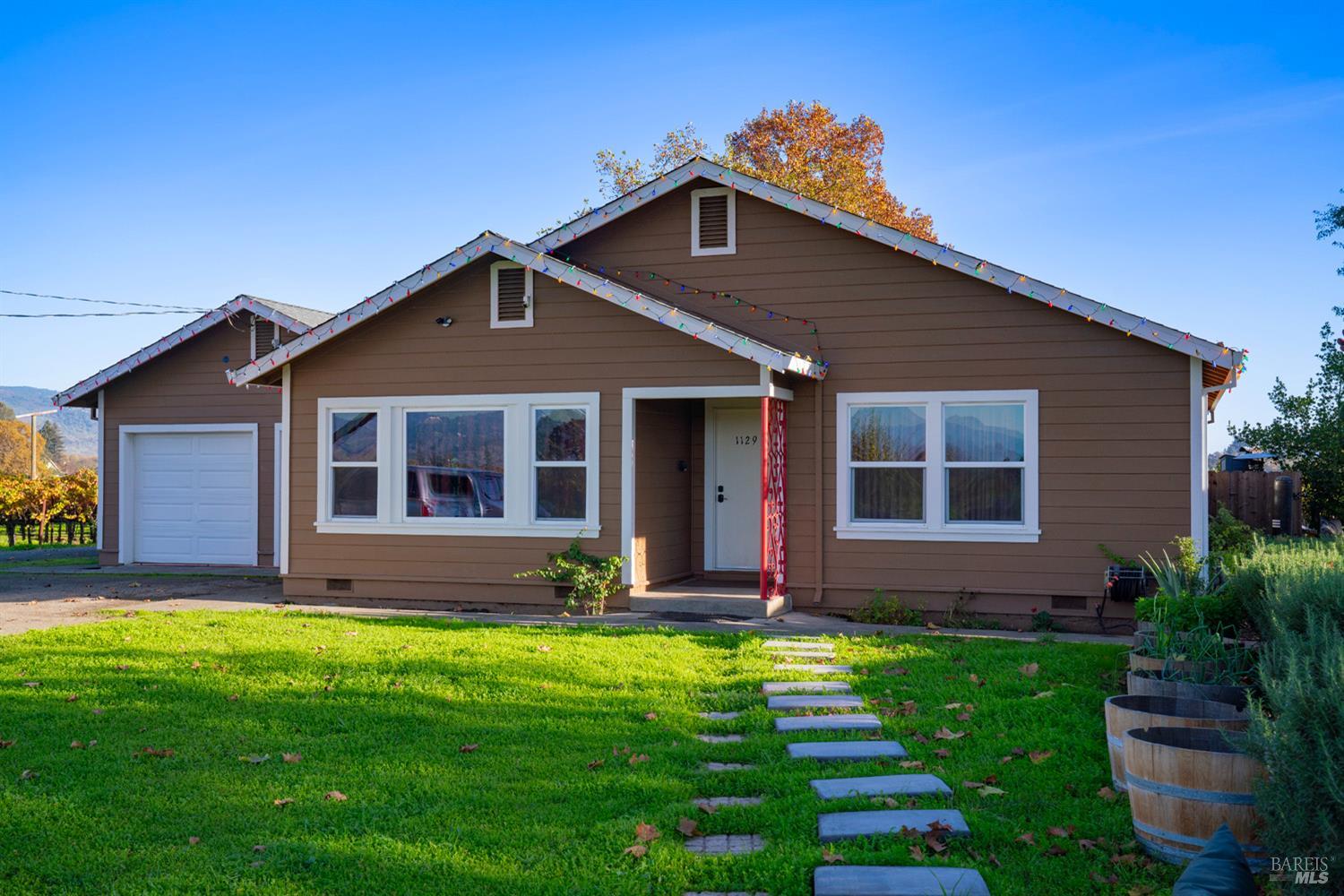 1135 Galleron Road St. Helena, CA 94574 - Photo 6 of 21 a front view of a house with a yard and garage