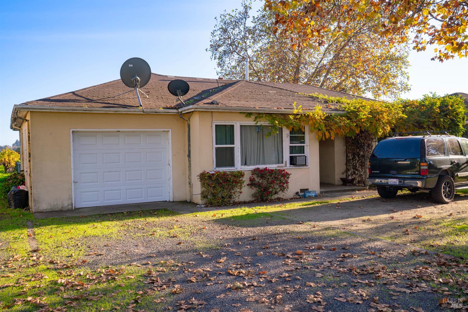 1135 Galleron Road St. Helena, CA 94574 - Photo 8 of 21 a front view of a house with a yard and garage