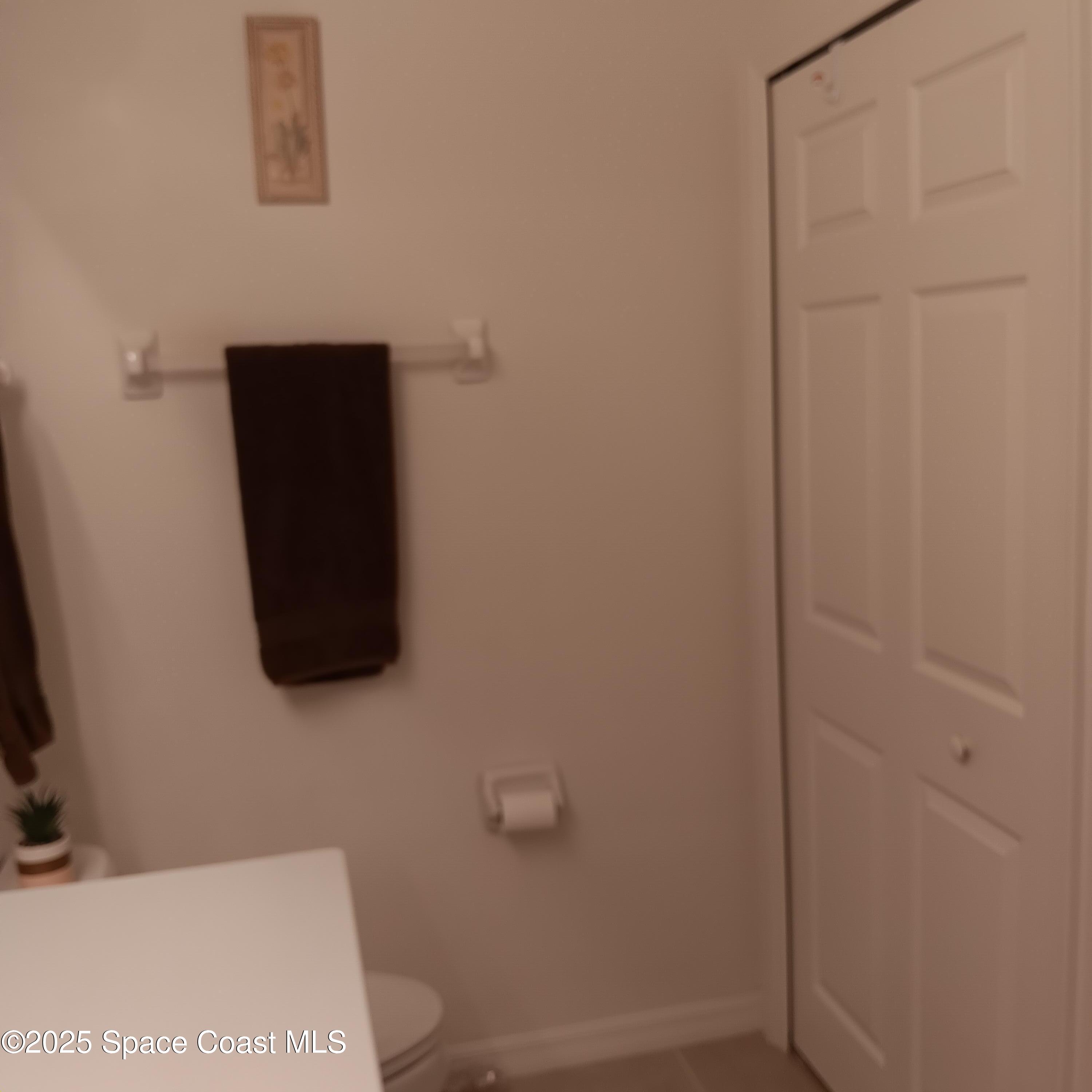 6858 Toland Drive, Unit 304 Melbourne, FL 32940 - Photo 18 of 31 a bathroom with a shower and a sink