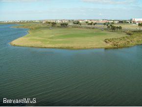 6858 Toland Drive, Unit 304 Melbourne, FL 32940 - Photo 2 of 31 a view of an ocean and beach