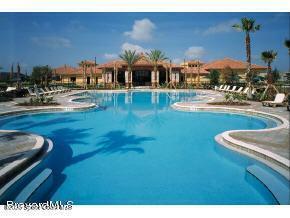 6858 Toland Drive, Unit 304 Melbourne, FL 32940 - Photo 31 of 31 a view of a swimming pool with outdoor seating