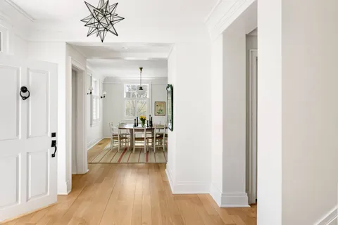 a view of a livingroom with furniture and hardwood floor