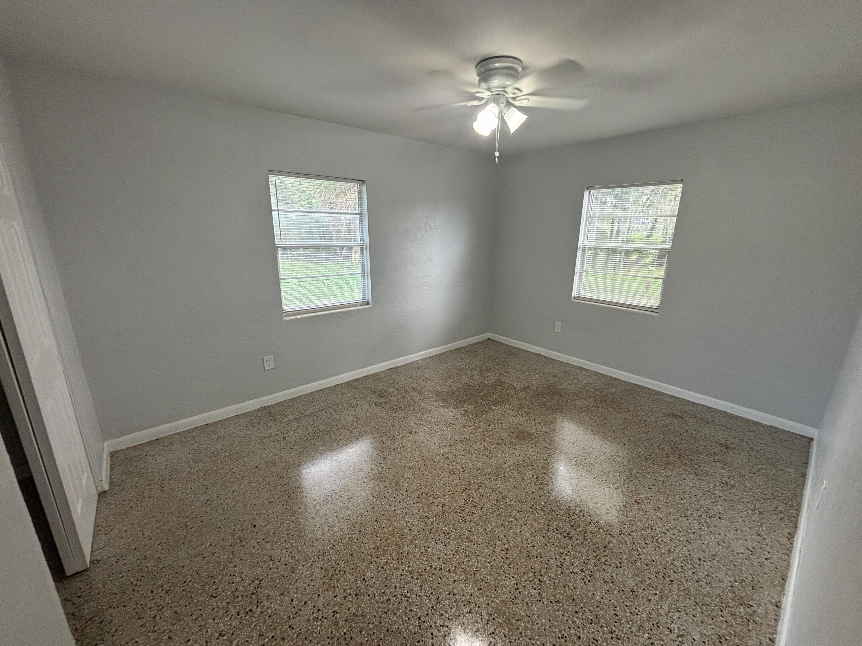 4305 Hammock Trail Mims, FL 32754 - Photo 13 of 16 an empty room with a window