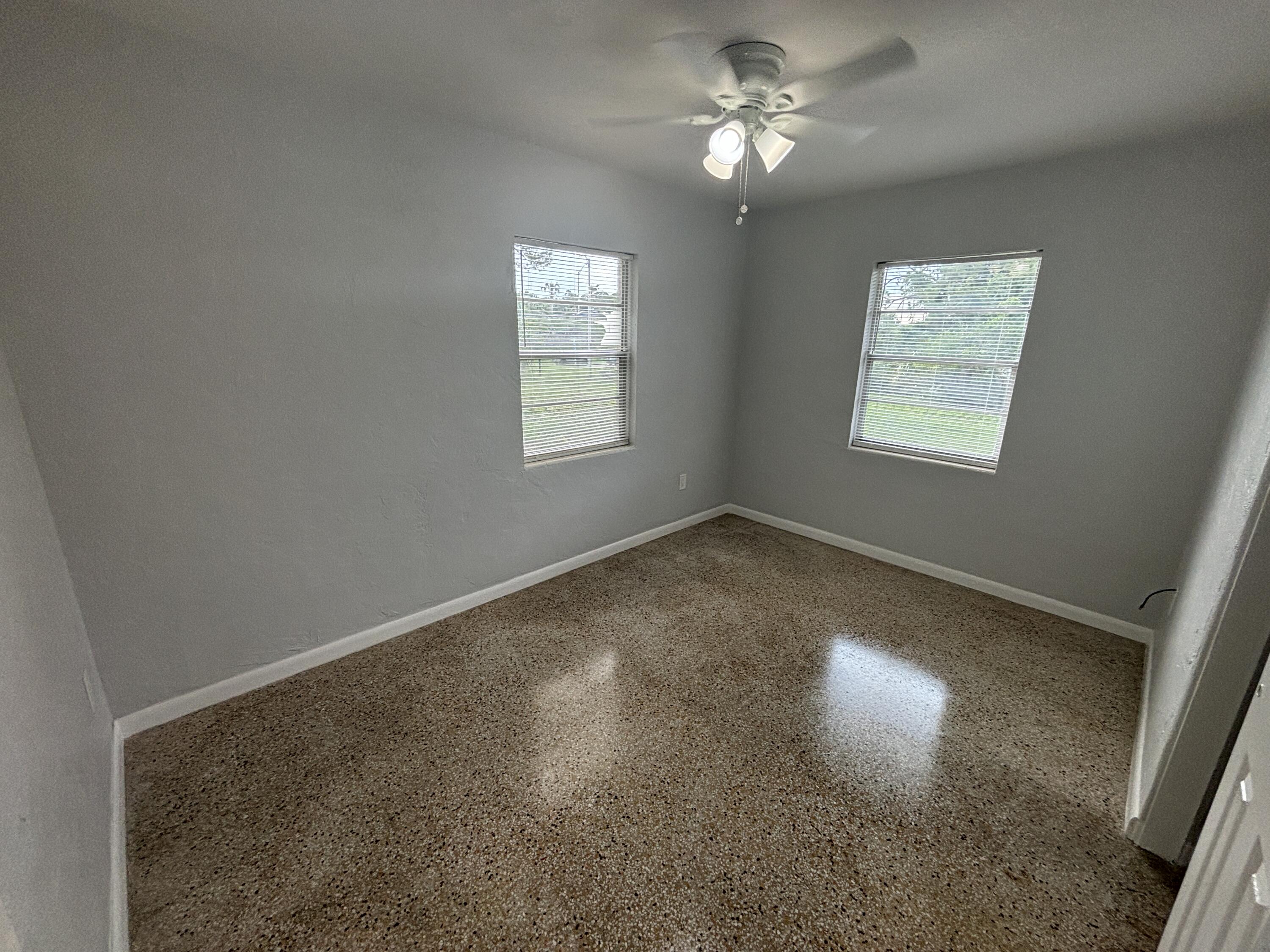 4305 Hammock Trail Mims, FL 32754 - Photo 14 of 16 a view of empty room with windows