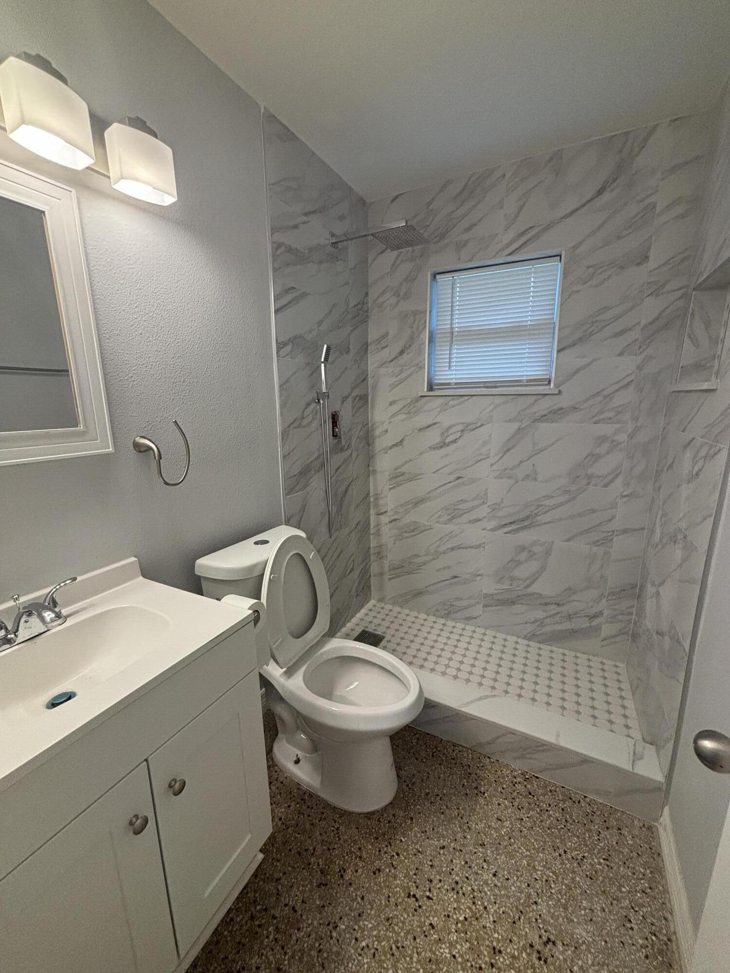 4305 Hammock Trail Mims, FL 32754 - Photo 15 of 16 a bathroom with a toilet sink and mirror