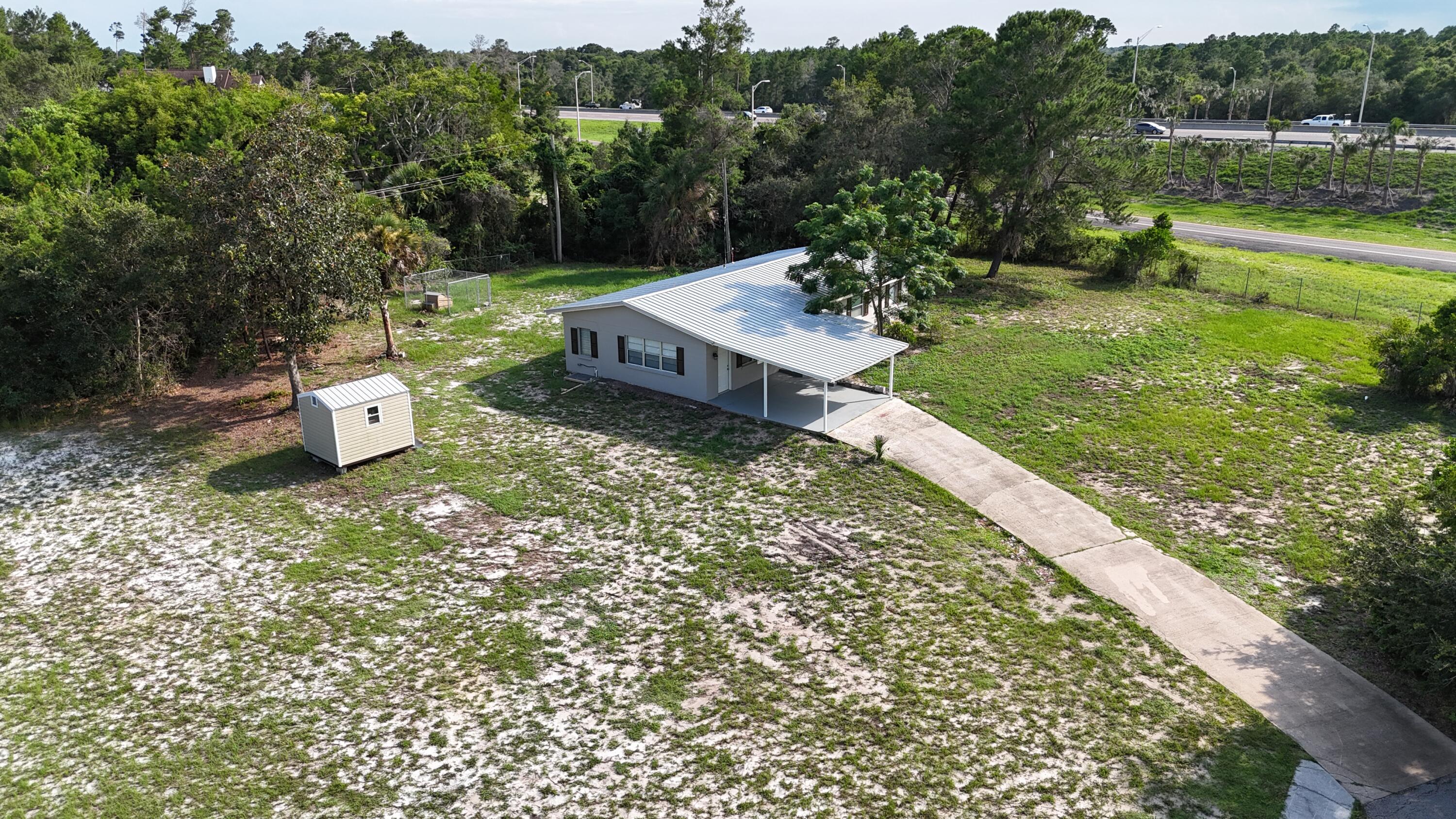 4305 Hammock Trail Mims, FL 32754 - Photo 2 of 16 a view of a garden with sitting area