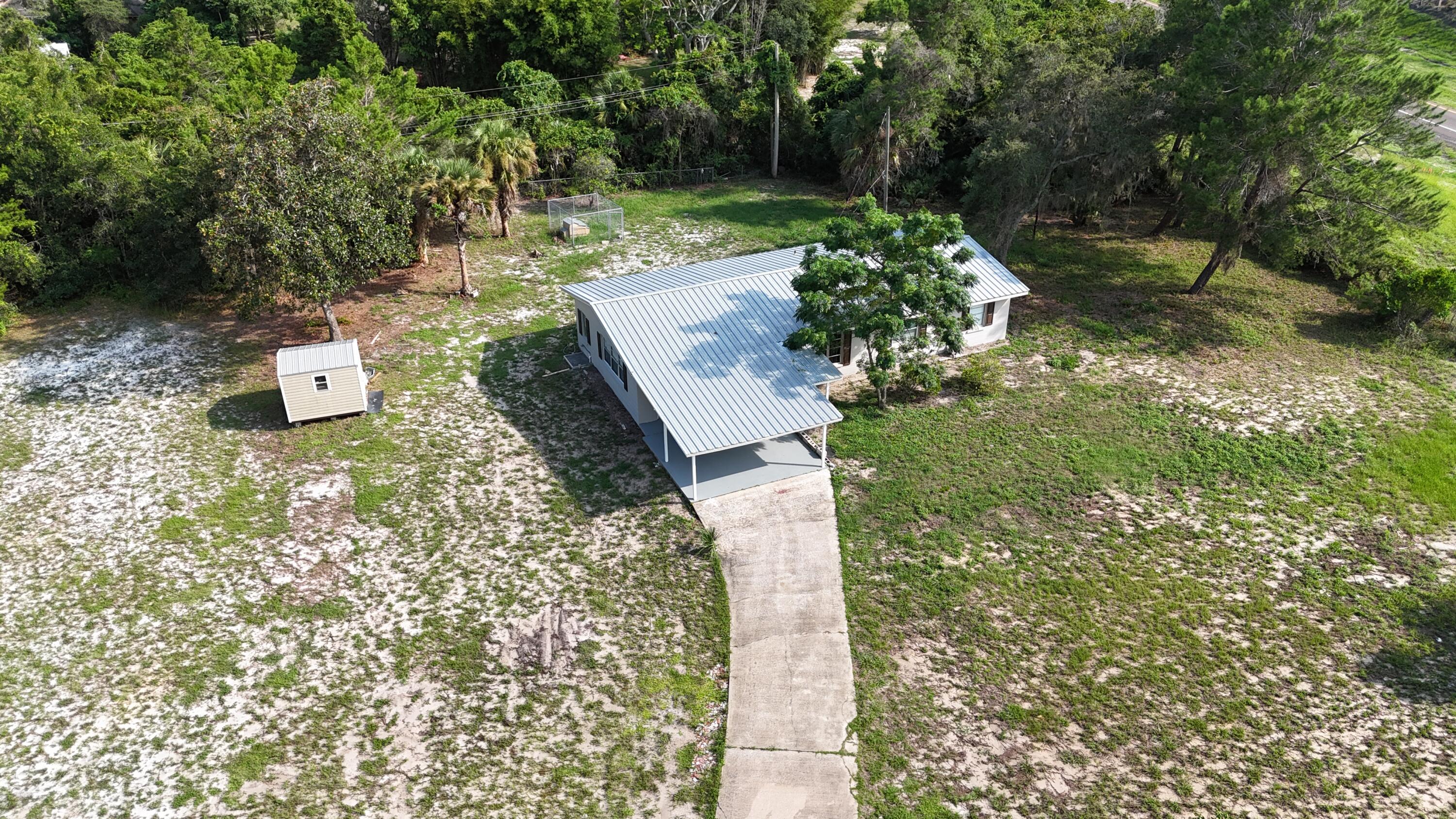 4305 Hammock Trail Mims, FL 32754 - Photo 3 of 16 a view of a yard with plants