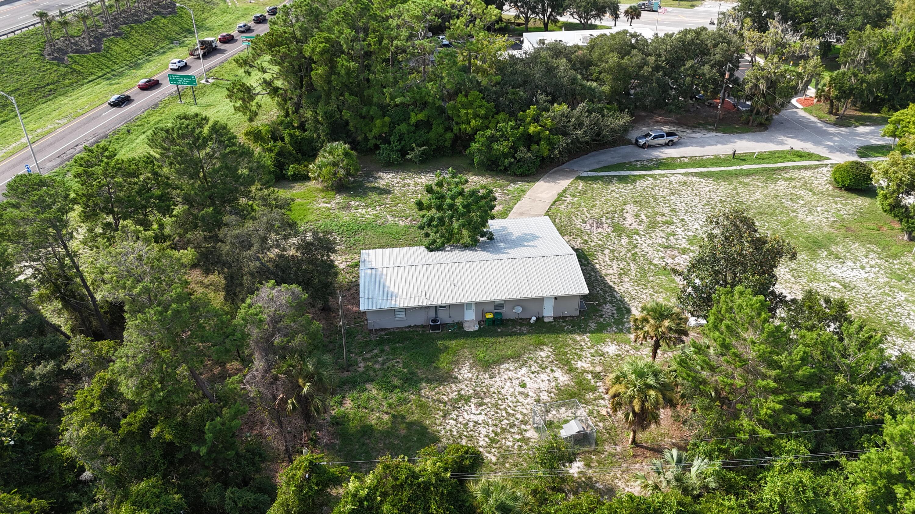 4305 Hammock Trail Mims, FL 32754 - Photo 4 of 16 an aerial view of a house with pool yard and outdoor seating