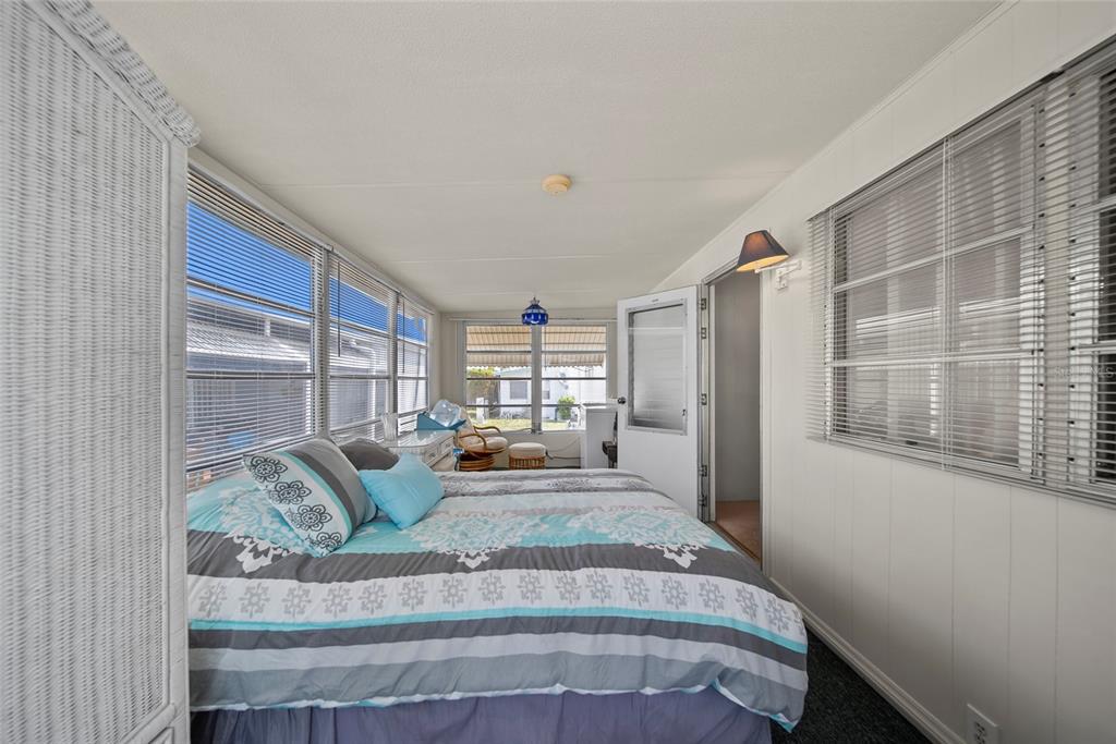 11047 102nd Way North, Unit 203 Largo, FL 33773 - Photo 12 of 26 a living room with furniture and a large window