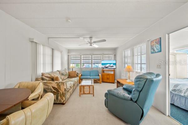 11047 102nd Way North, Unit 203 Largo, FL 33773 - Photo 2 of 26 a living room with furniture and a large window
