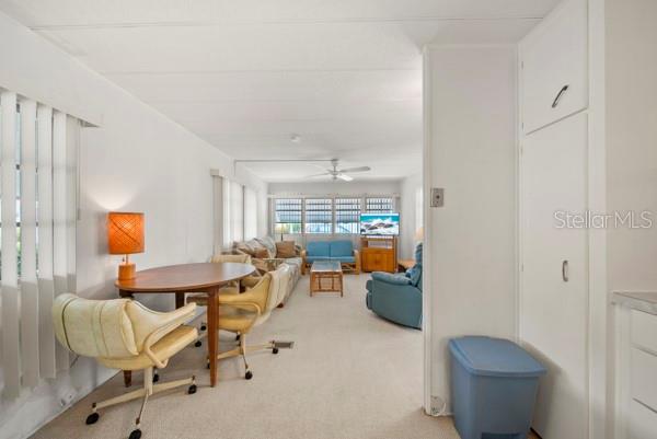 11047 102nd Way North, Unit 203 Largo, FL 33773 - Photo 4 of 26 a living room with furniture and a fireplace