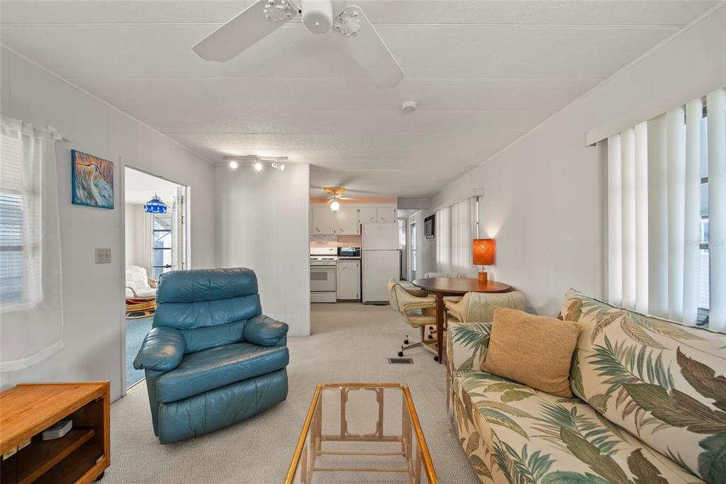 11047 102nd Way North, Unit 203 Largo, FL 33773 - Photo 6 of 26 a living room with furniture and a couch