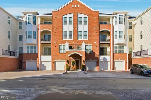 a front view of a building with a road