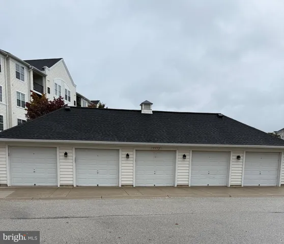 a front view of a house with garage