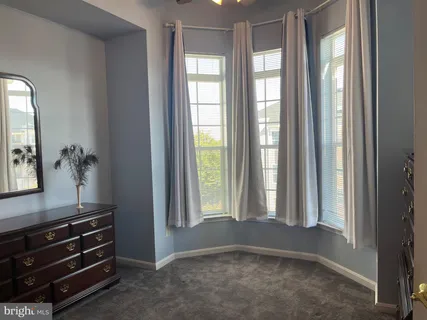 a room with window and furniture