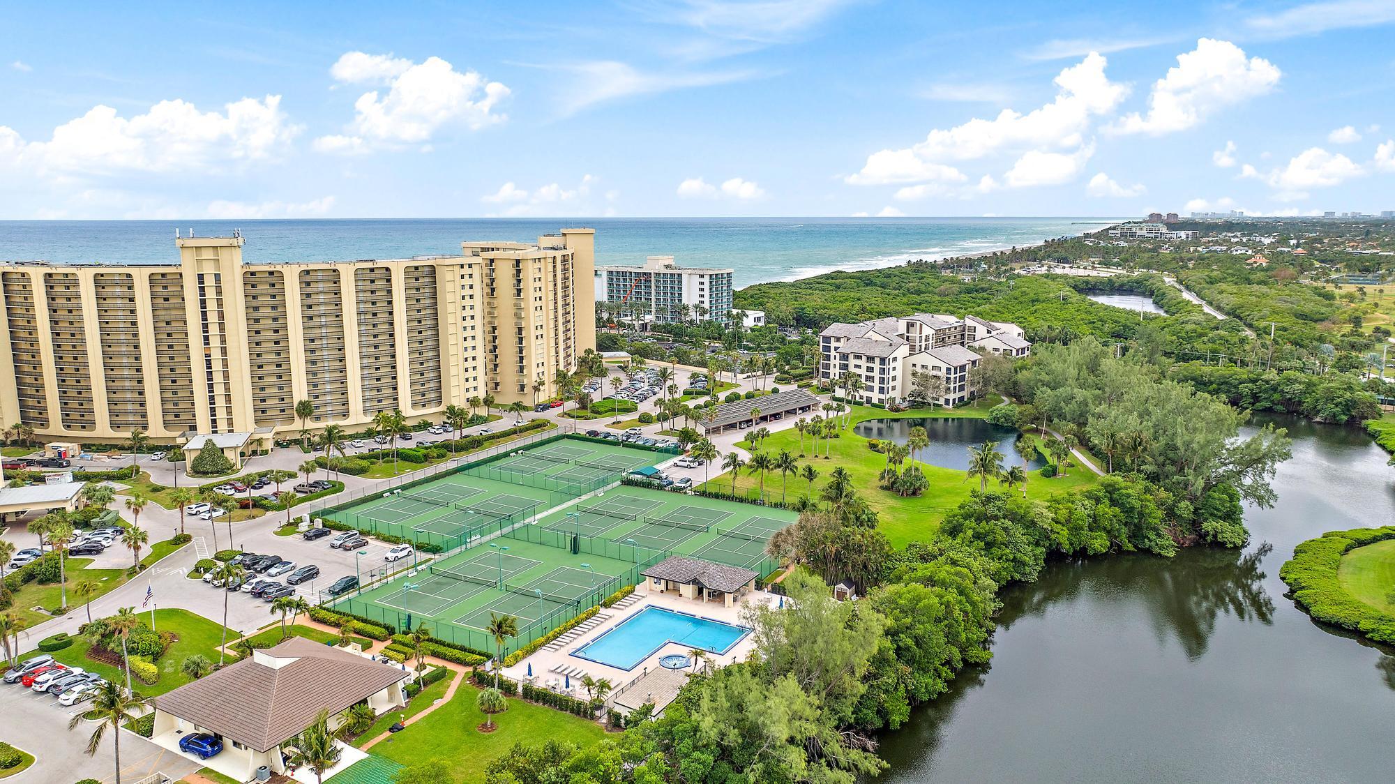 400 Ocean Trail Way, Unit 601 Jupiter, FL 33477 - Photo 21 of 42 a view of a swimming pool and outdoor space