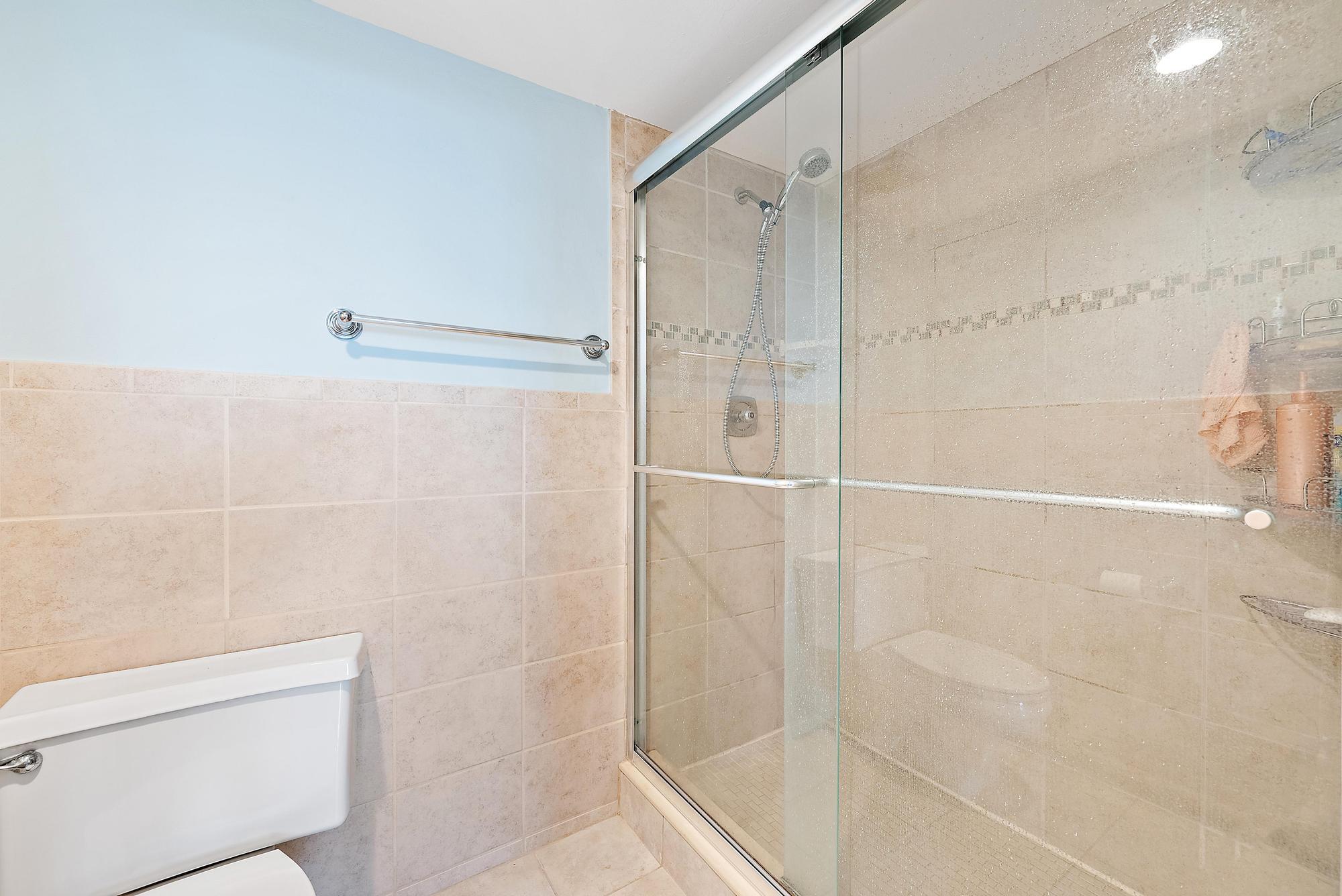 400 Ocean Trail Way, Unit 601 Jupiter, FL 33477 - Photo 29 of 42 a bathroom with a shower