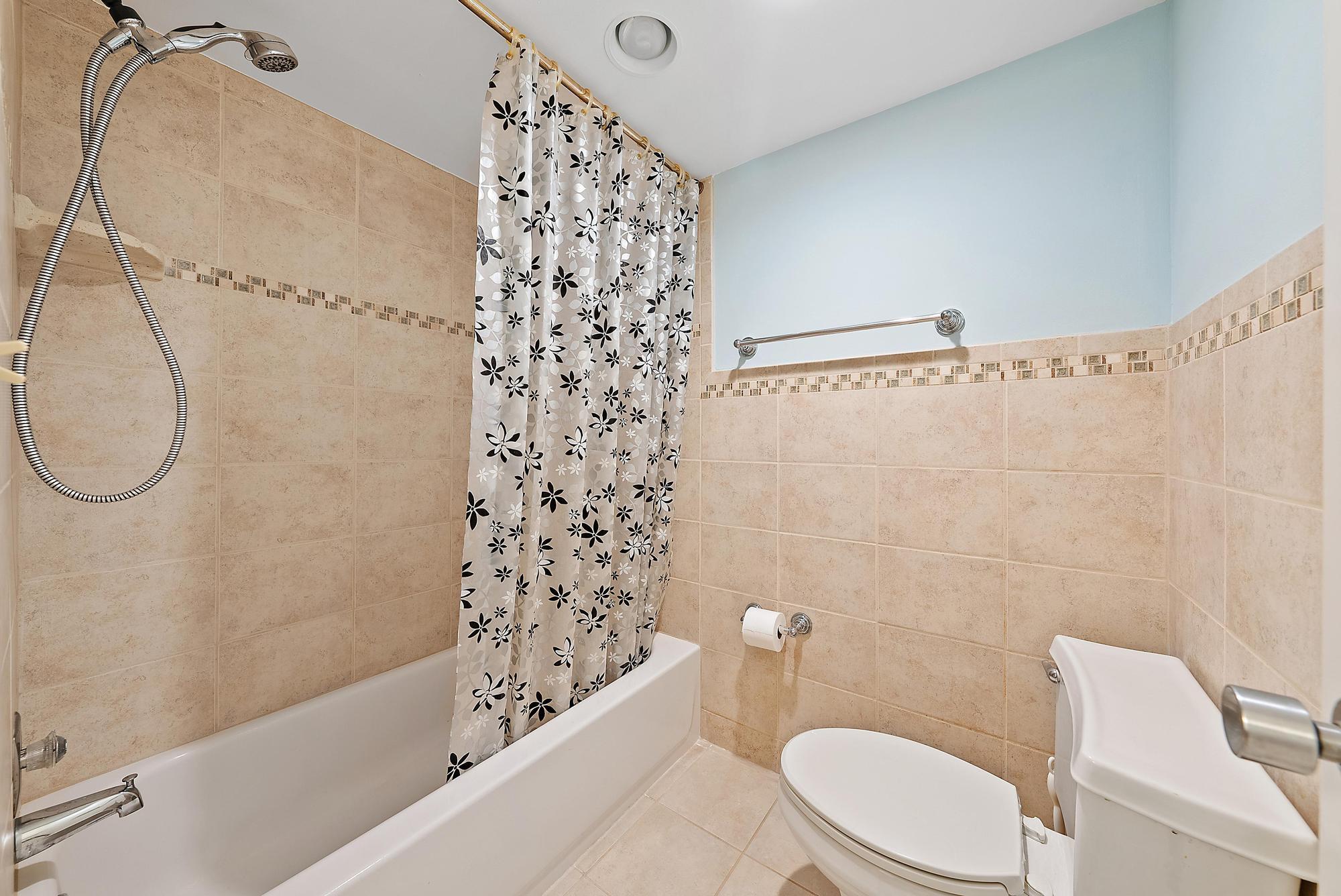 400 Ocean Trail Way, Unit 601 Jupiter, FL 33477 - Photo 32 of 42 a bathroom with a toilet and a shower