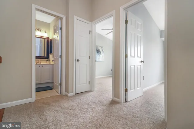 a bathroom with a toilet sink and a mirror