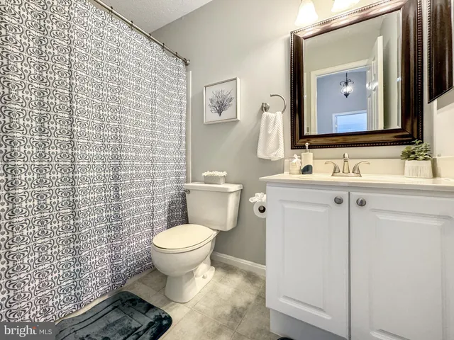 an empty room with window and air conditioner