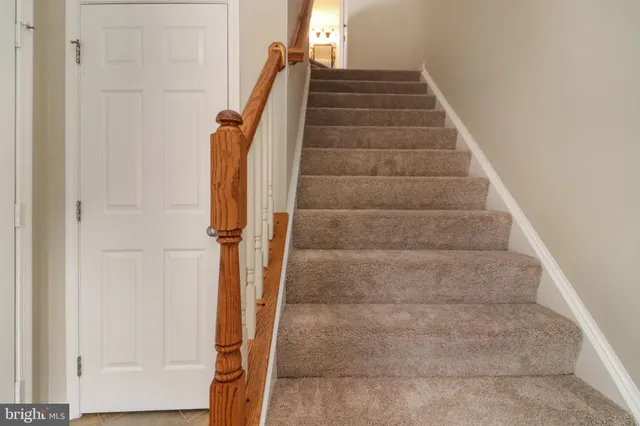 a view of staircase with white walls