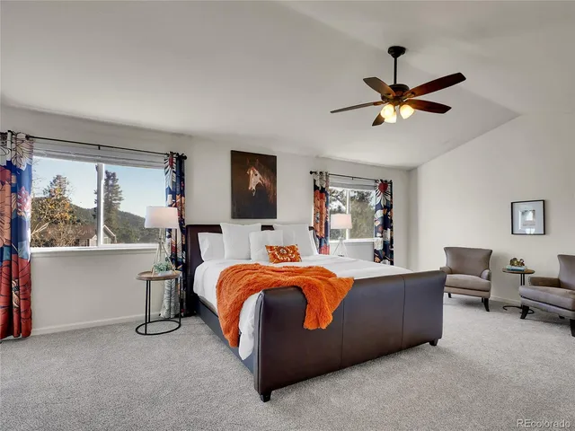 a bed room with a bed and a chandelier