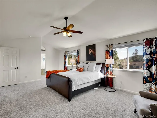 a bed room with a bed and a window