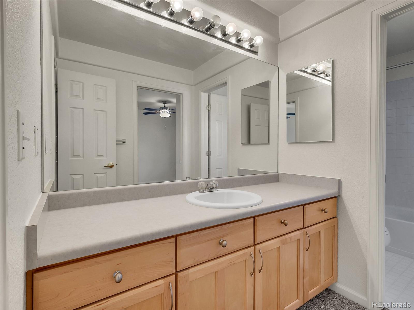 13586 Wamblee Trail Conifer, CO 80433 - Photo 17 of 38 a bathroom with a sink and a mirror