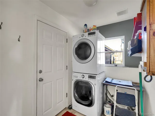 a view of a hallway with washer and dryer