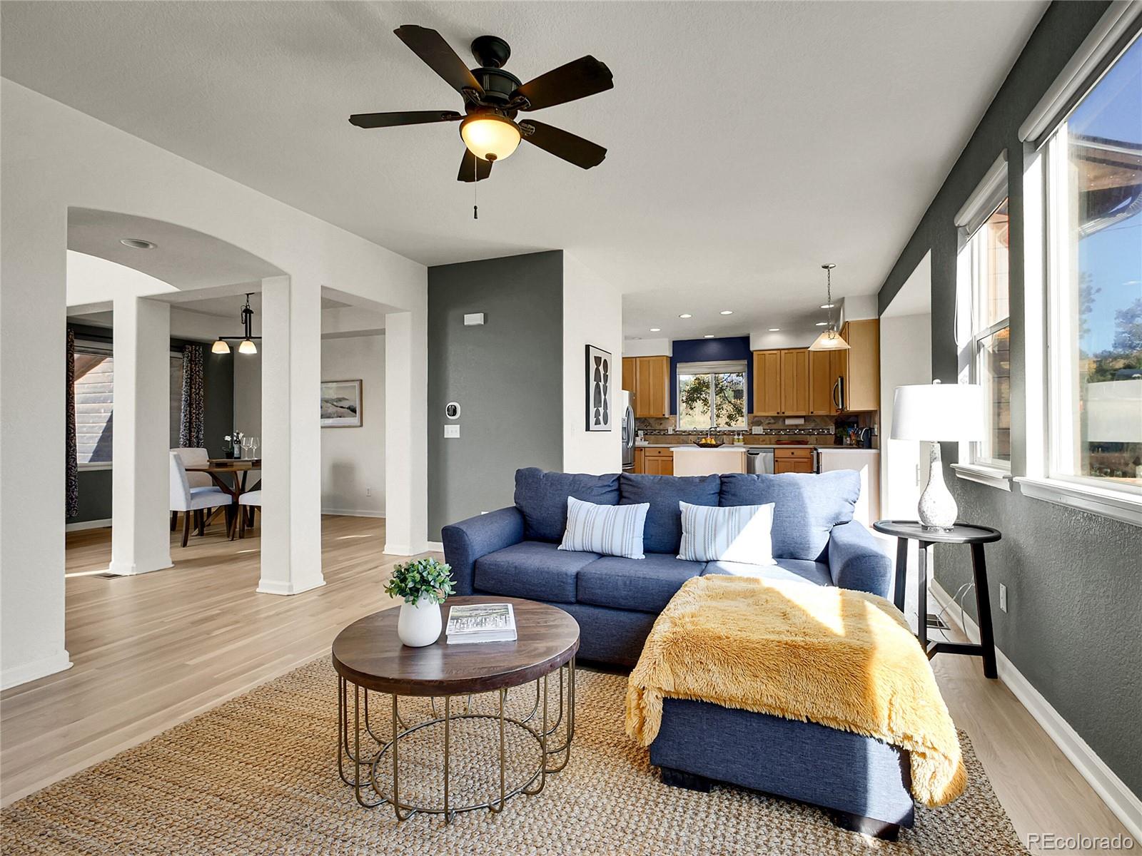 13586 Wamblee Trail Conifer, CO 80433 - Photo 6 of 38 a living room with furniture a rug and a large window