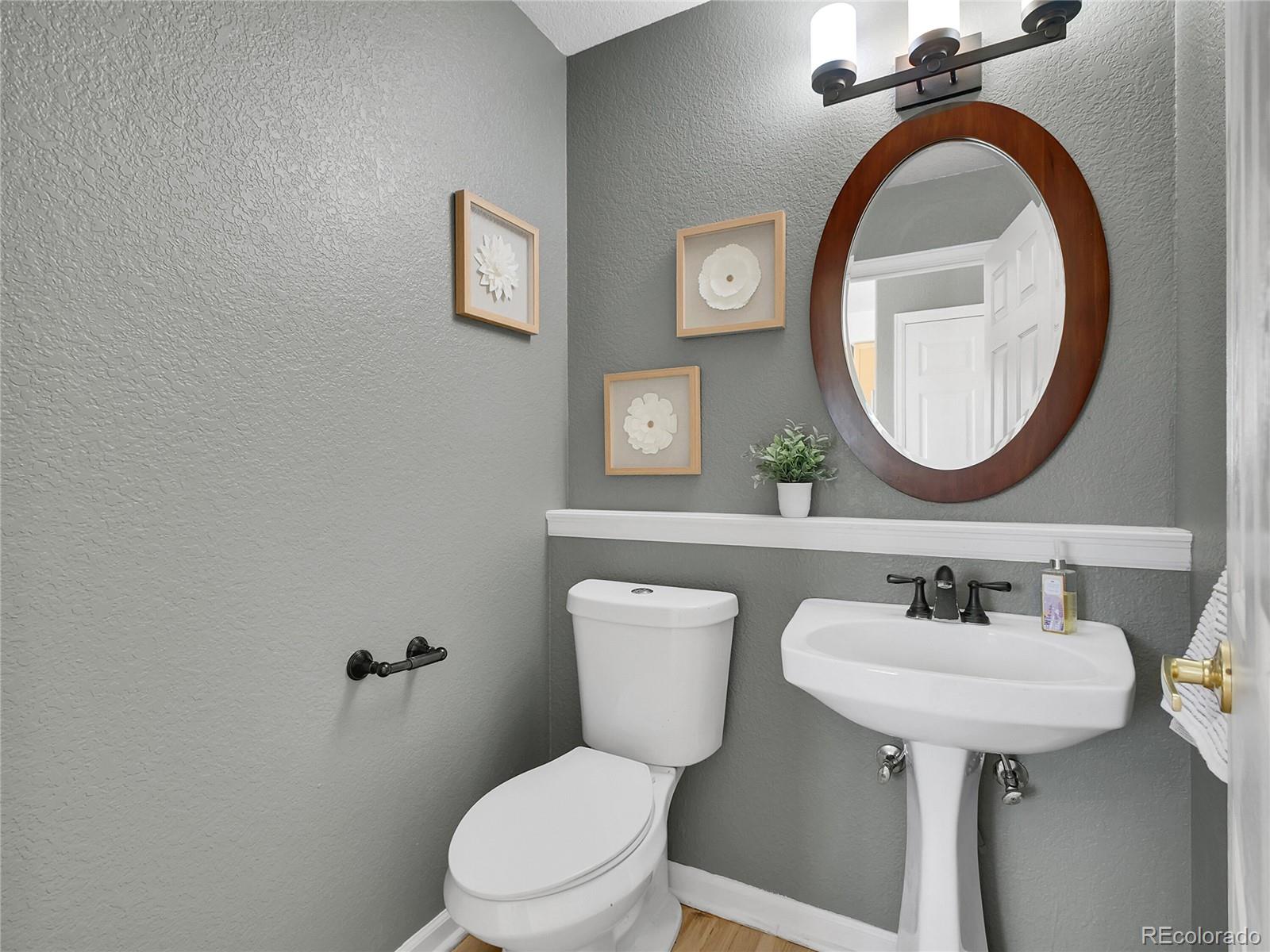 13586 Wamblee Trail Conifer, CO 80433 - Photo 10 of 38 a bathroom with a sink mirror and toilet