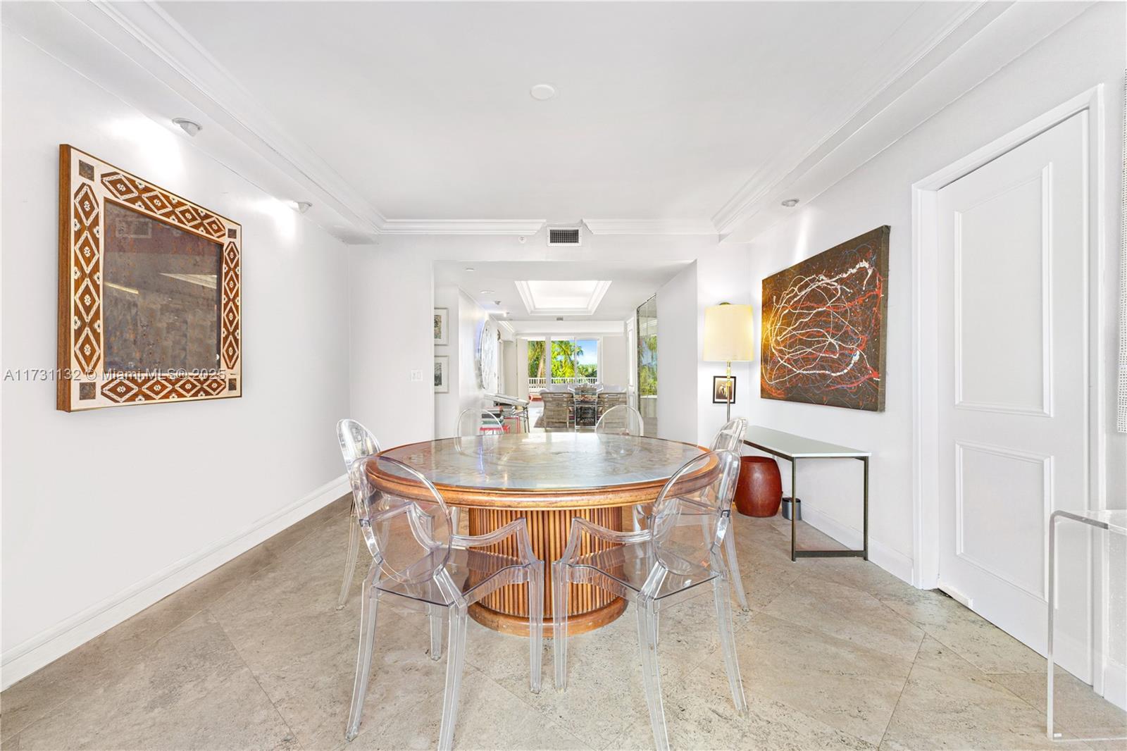 781 Crandon Boulevard, Unit 406 Key Biscayne, FL 33149 - Photo 17 of 35 a dining room with furniture and window
