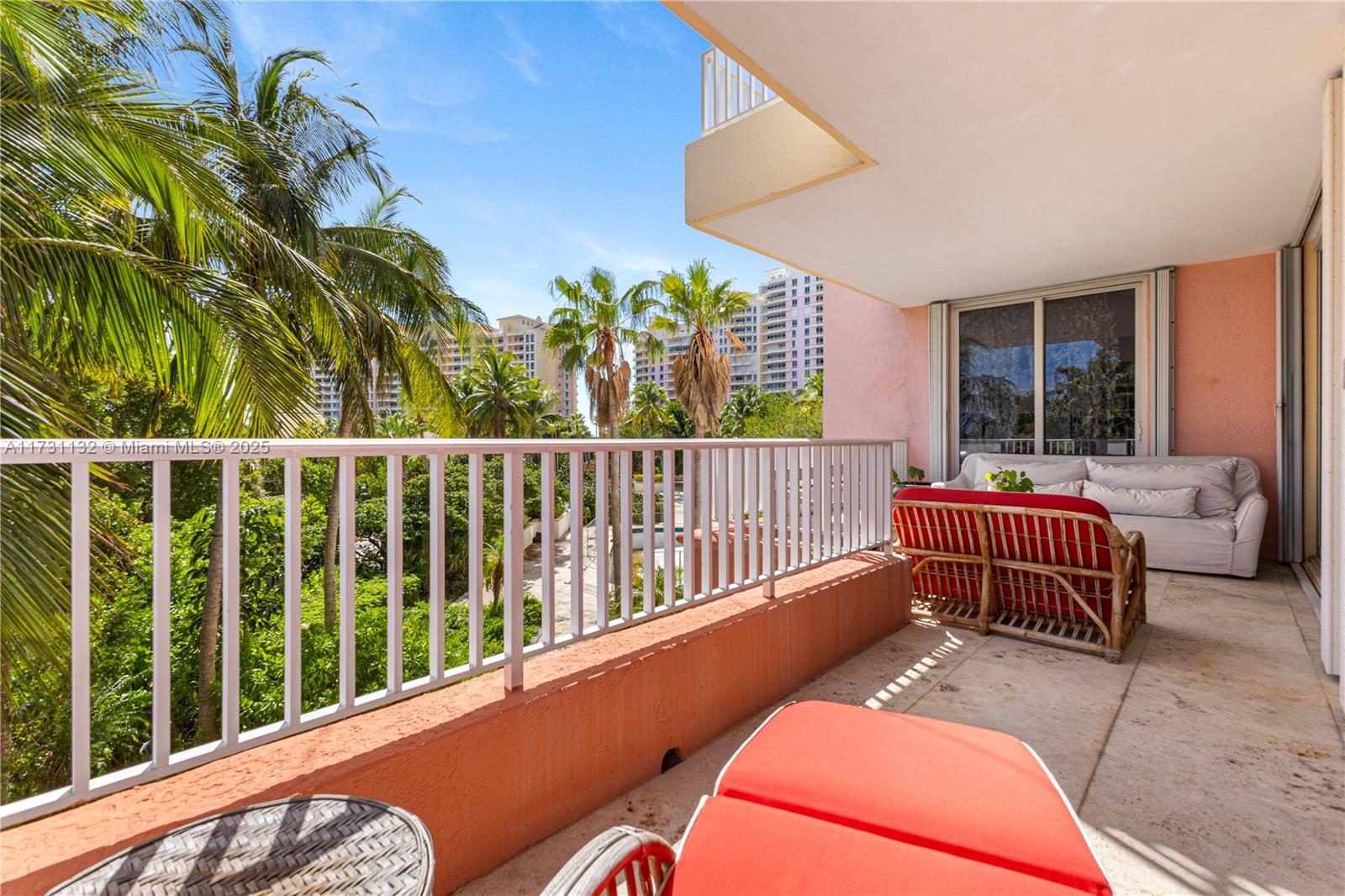 781 Crandon Boulevard, Unit 406 Key Biscayne, FL 33149 - Photo 19 of 35 a balcony with furniture and a potted plant