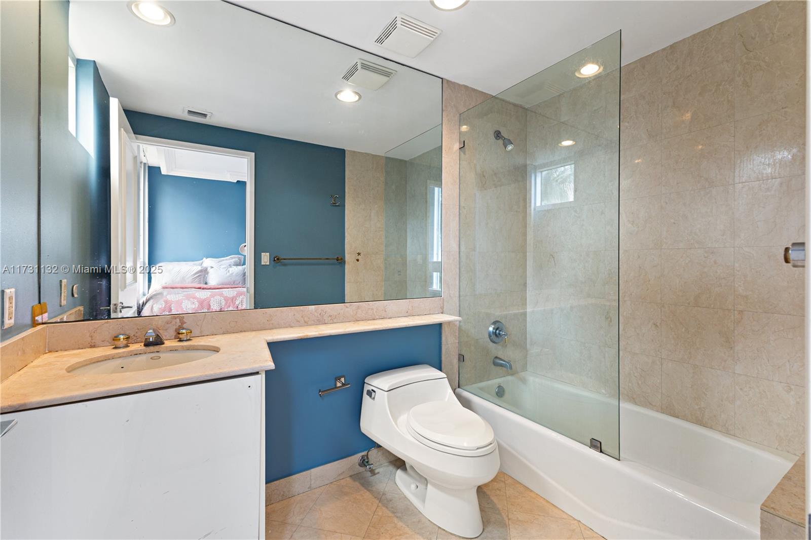 781 Crandon Boulevard, Unit 406 Key Biscayne, FL 33149 - Photo 26 of 35 a bathroom with a sink a toilet and shower