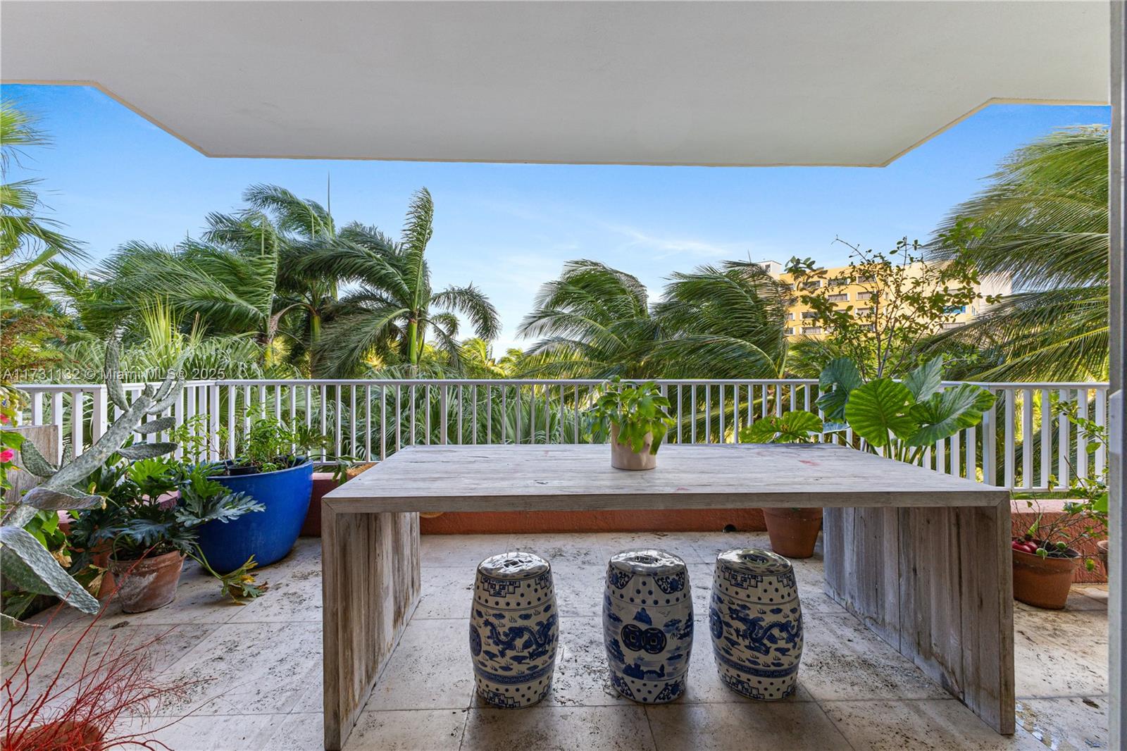 781 Crandon Boulevard, Unit 406 Key Biscayne, FL 33149 - Photo 8 of 35 a view of a patio with iron fence